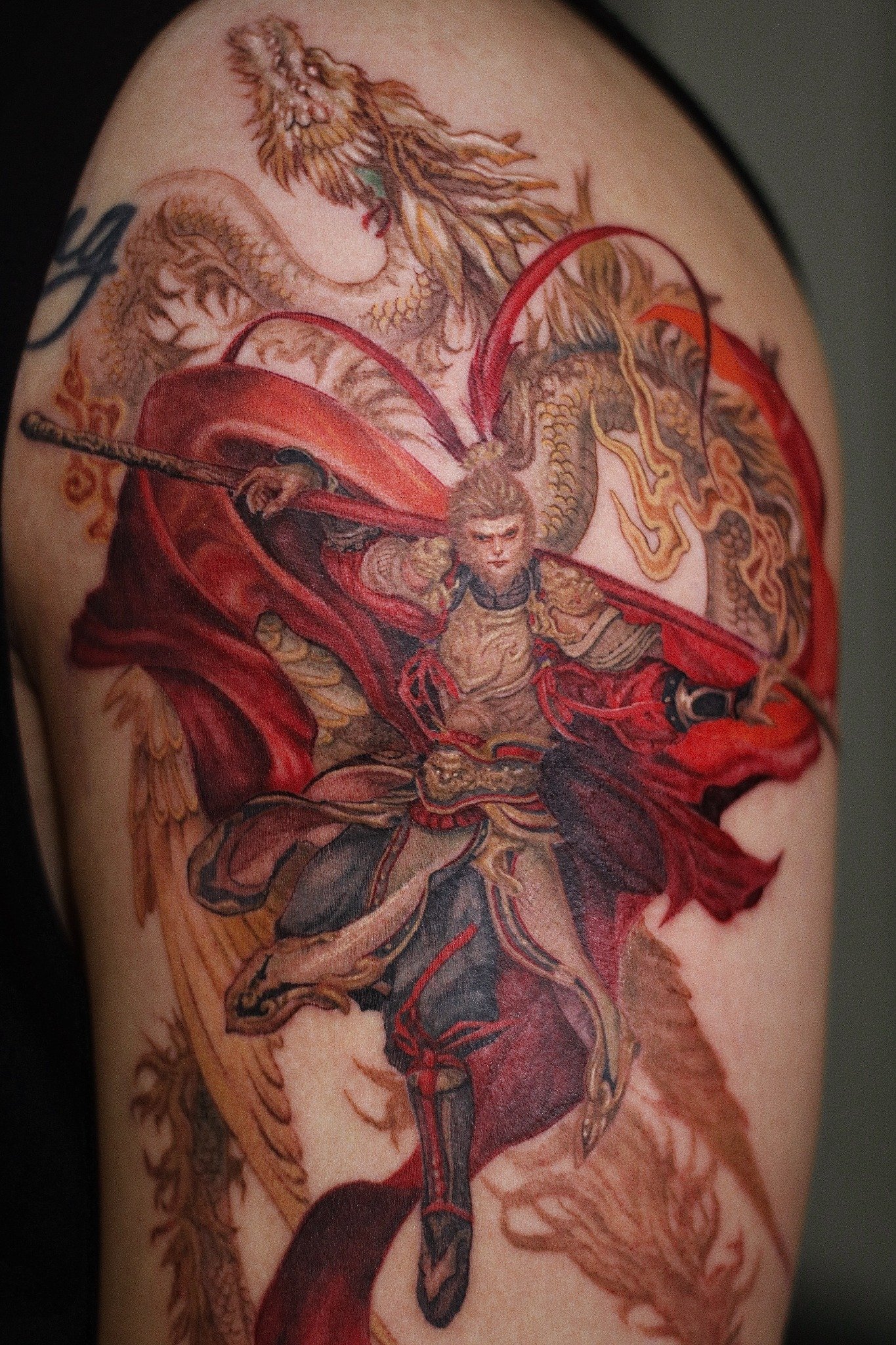 Monkey King and dragon color tattoo by Hoang Bao at Overthink-Ink Saigon