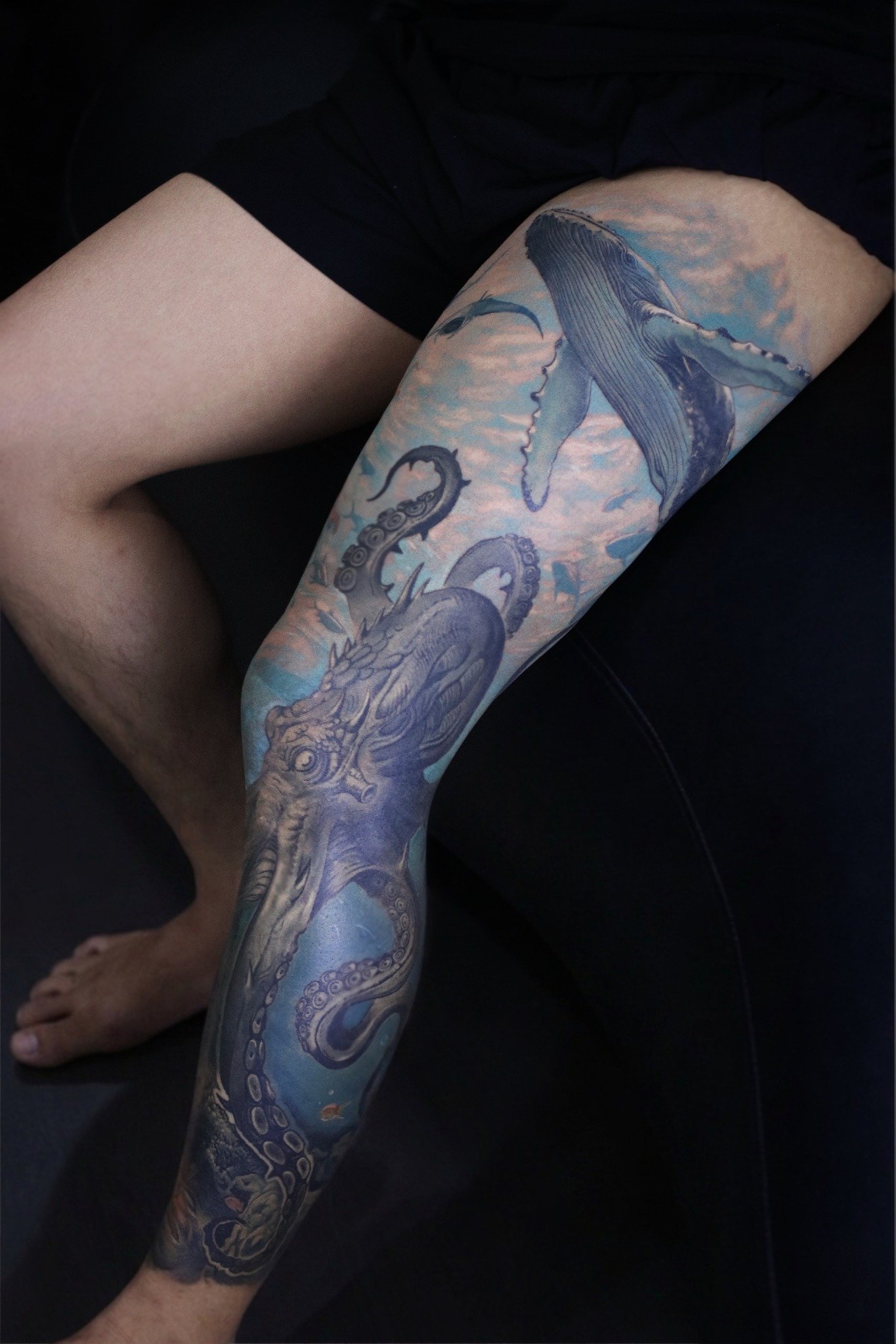 Blue whale and octopus leg sleeve tattoo by Hoang Bao at Overthink-Ink Saigon