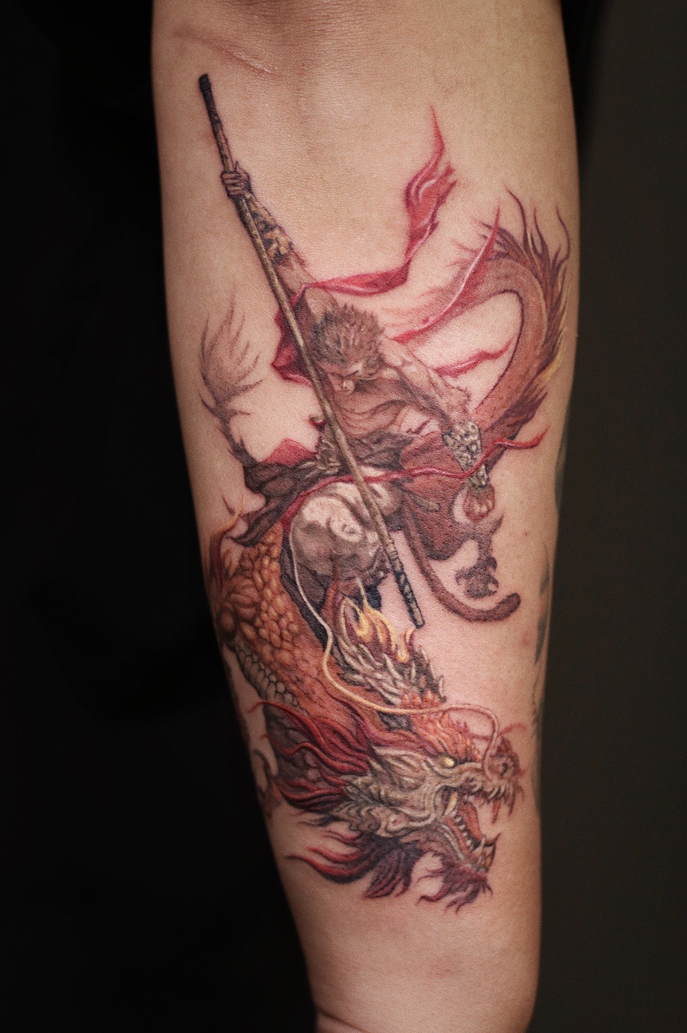 Illustrative Monkey King and dragon tattoo by Hoang Bao at Overthink-Ink Saigon
