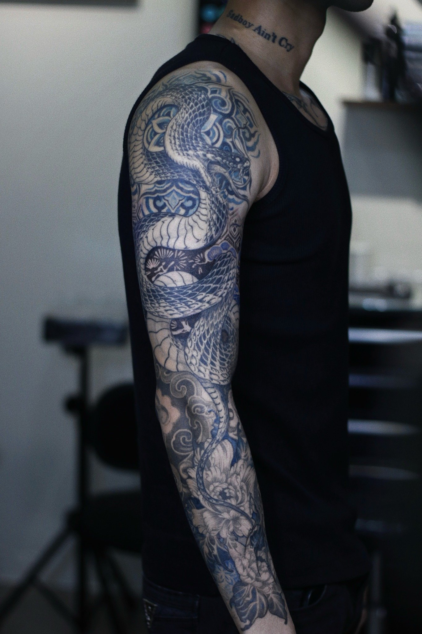 Full snake and floral arm sleeve by Hoang Bao at Overthink-Ink Saigon