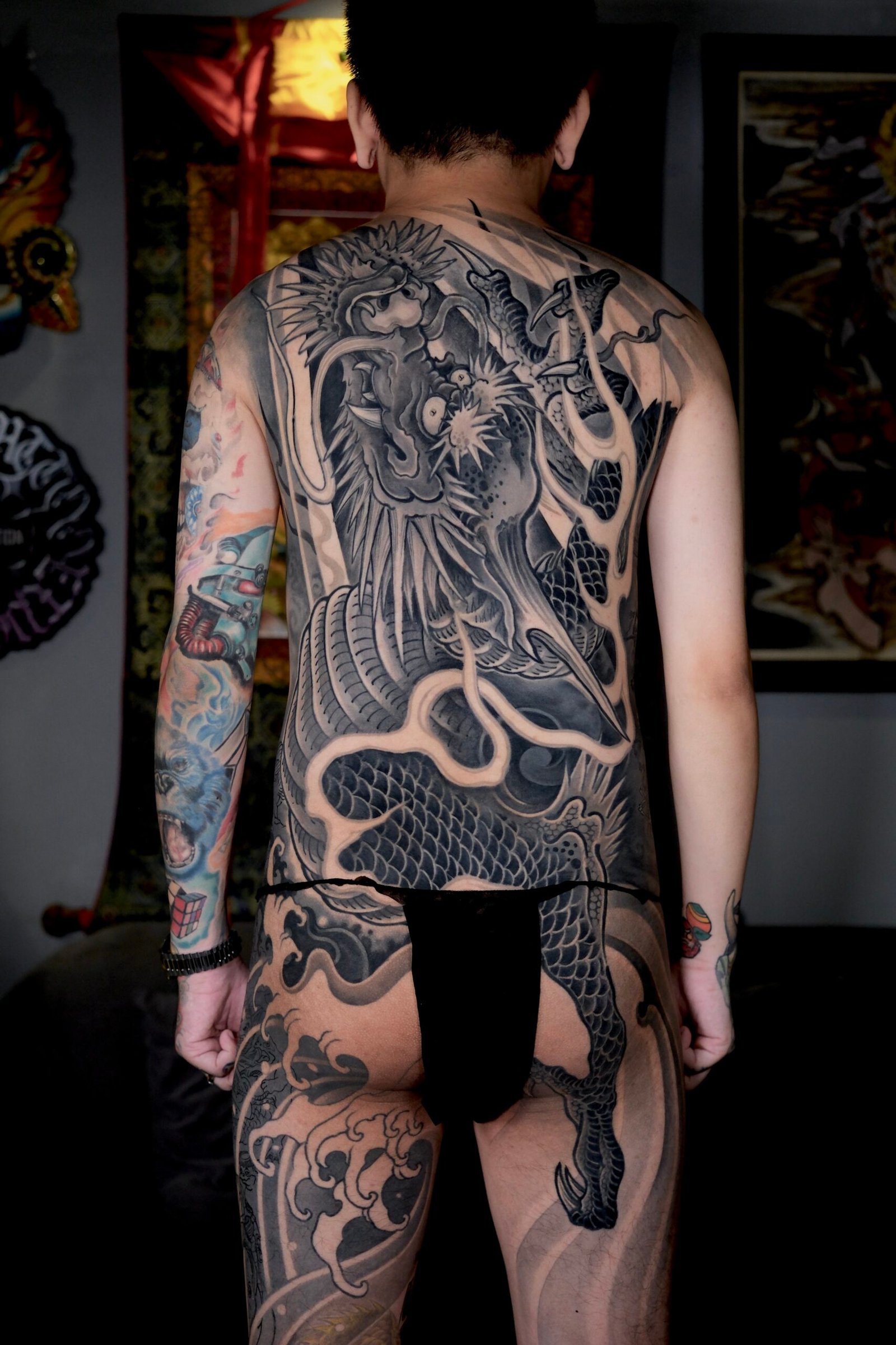 Asian blackwork leg tattoo by Thuong Nguyen at Overthink-Ink Saigon